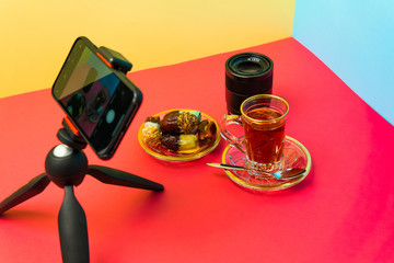 mobile photography, candies on plate, camera lens, saffron tea