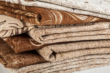 Stacked pile of different and colorful textile materials