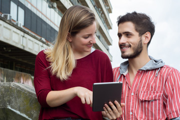 Two University students studying together outdoors