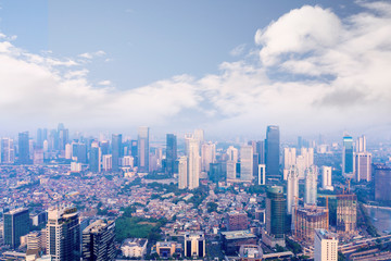 Naklejka na ściany i meble Jakarta cityscape with air pollution smoke