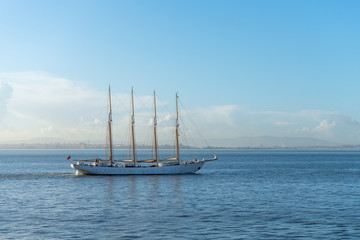 Naklejka na ściany i meble Four masts sailing ship at sea
