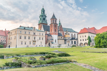 Evening view of Wawel Royal Castle complex with Wawel Cathedral or The Royal Archcathedral Basilica of Saints Stanislaus and Wenceslaus at sunset.