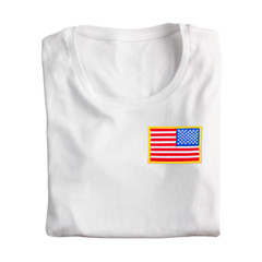 White folded t-shirt with embroidered American USA flag isolated on white background. Blank folded...