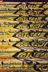 Old stone stairway with shadows from the banister.