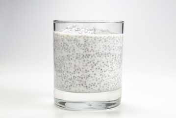 Chia pudding  in glass on a white background. Space for text or design.