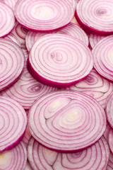 Onion slices as a background. Top view.