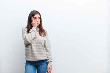 young pretty woman feeling bored, frustrated and sleepy after a tiresome, dull and tedious task,...