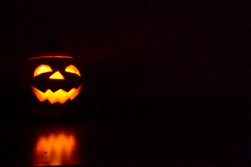 halloween pumpkin jack-o-lantern on black background