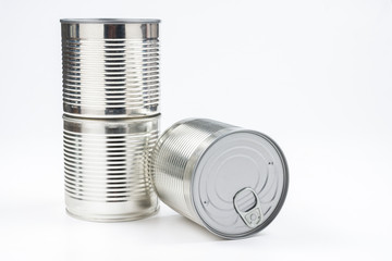 Group of silver canned food on white background.