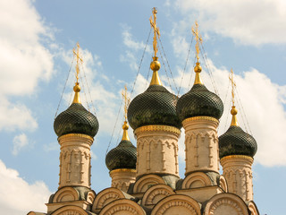 Fototapeta na wymiar Domes of Saint Sophia Church in Middle Sadovniki, Moscow, Russia with clouds on the background