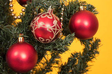 Obraz na płótnie Canvas christmas tree decoration detail on color background