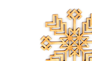 Winter, Christmas, New Year greeting card. Wooden decoration - white snowflake, star. Decor made from natural wood. Isolated on white background. Closeup. Place for text, copy space. Top view