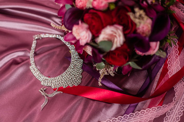 the bride's bouquet boutonniere and necklace with shining cubic zirconias