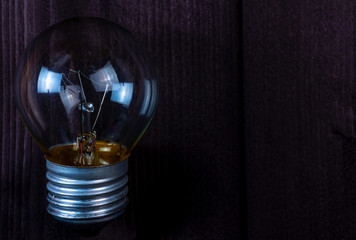 Small light bulb on background