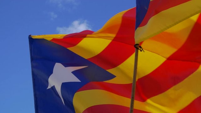 Catalan Flags waving against the blue sky. Catalonia country wants the independence from Spain