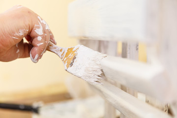 Person renovating wooden hanger
