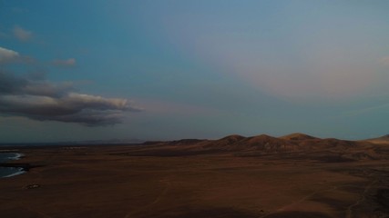 sunset stroking the clouds the sky the earth and the sea