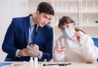 Expert criminologist working in the lab for evidence