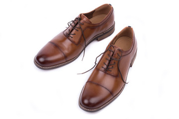 Classic leather elegant shoe on a white background. Beautiful brown luxury and casual leather men shoes. Fashion accessory. Closeup, top view.Both leg. Isolated. 