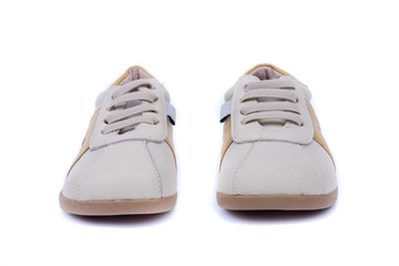 Classic leather elegant shoes on a white background. Beautiful cream, gray, brown kids casual leather shoes. One to the other. Top, side view. Both legs. Isolated.