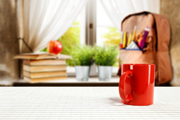 table background of free space and blurred window sill with schoolbag 