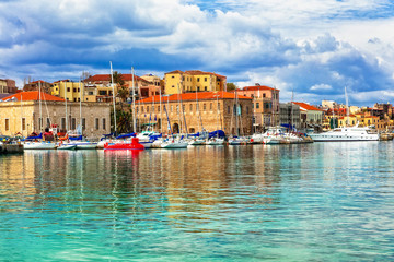 Obraz na płótnie Canvas Travel in Greece - beautiful pier of old town Chania in Crete island