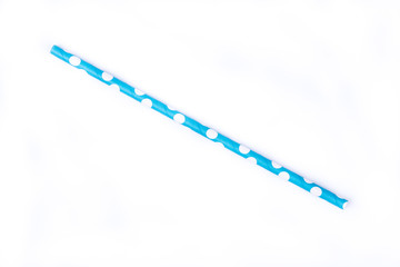 Closeup of drinking straw for party.  Blue with white dots. Top view of colorful disposable eco-friendly straw for summer cocktails. Paper coctail colorful straw isolated on white  background, isolate