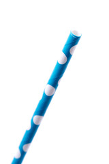 Very closeup of drinking straw for party. Blue with whitw dots. Side view of colorful disposable eco-friendly straw for summer cocktails. Paper coctail colorful straw isolated on white  background, is