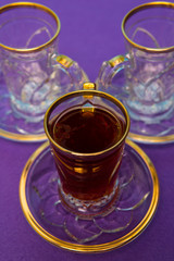 tea with saffron, crystal plate and teacup with golden design, vintage set, strong tea, spicy tea
