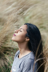 Bolivian girl meditating on high pastures