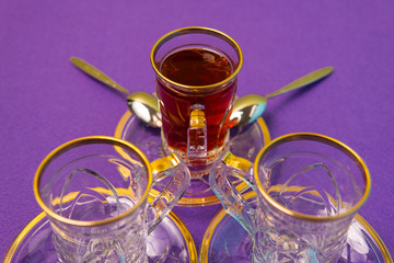 tea with saffron, crystal plate and teacup with golden design, vintage set, strong tea, spicy tea
