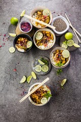 set of delicious traditional Asian food in bowls, top view 