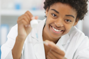 close view of smiling female scientist