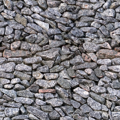 Seamless texture often stacked granite stones of irregular shape without a connecting raster