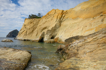 Sandy rock and ocean or sea. blue sky, clear weather