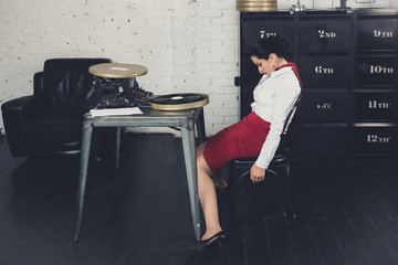 Crime scene with strangled pretty business woman in office