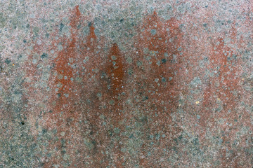 Grunge abstract background. Gray stone wall with red drips of paint, dots and spots.