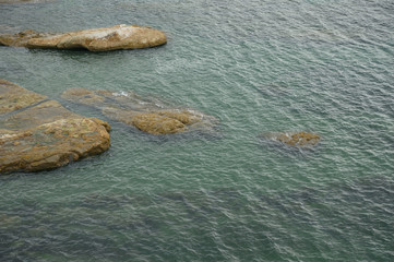 Texture of water and stone, top view. Ocean, sea