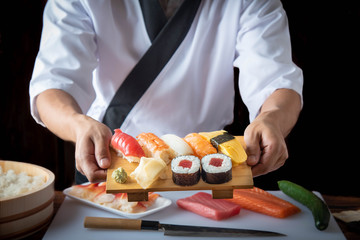 japanese sushi chef image with raw fish