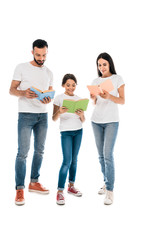 cheerful kid and parents standing and reading books isolated on white