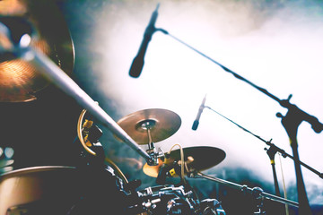 Live music and nigth concert background.Abstract image of drum on stage and smoke illuminated by...
