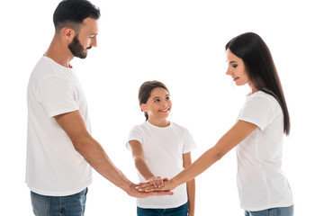 Obraz premium smiling family putting hands together isolated on white