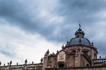mexican cathedral and clouded blue sky