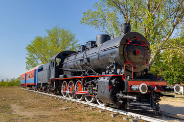 Fototapeta na wymiar Old steam black train locomotive