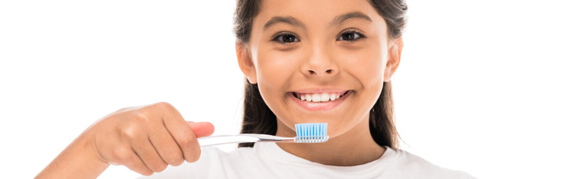 Panoramic Shot Of Happy Kid Holding Toothbrush Isolated On White