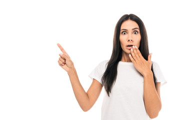 shocked woman pointing with finger isolated on white