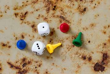 A few chips for board games on a rusty background.