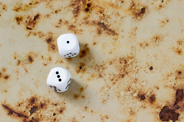 A few chips for board games on a rusty background.