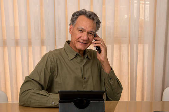 Handsome Older Gentleman Working In His Home Office