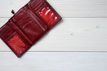Leather purse on a white wooden background